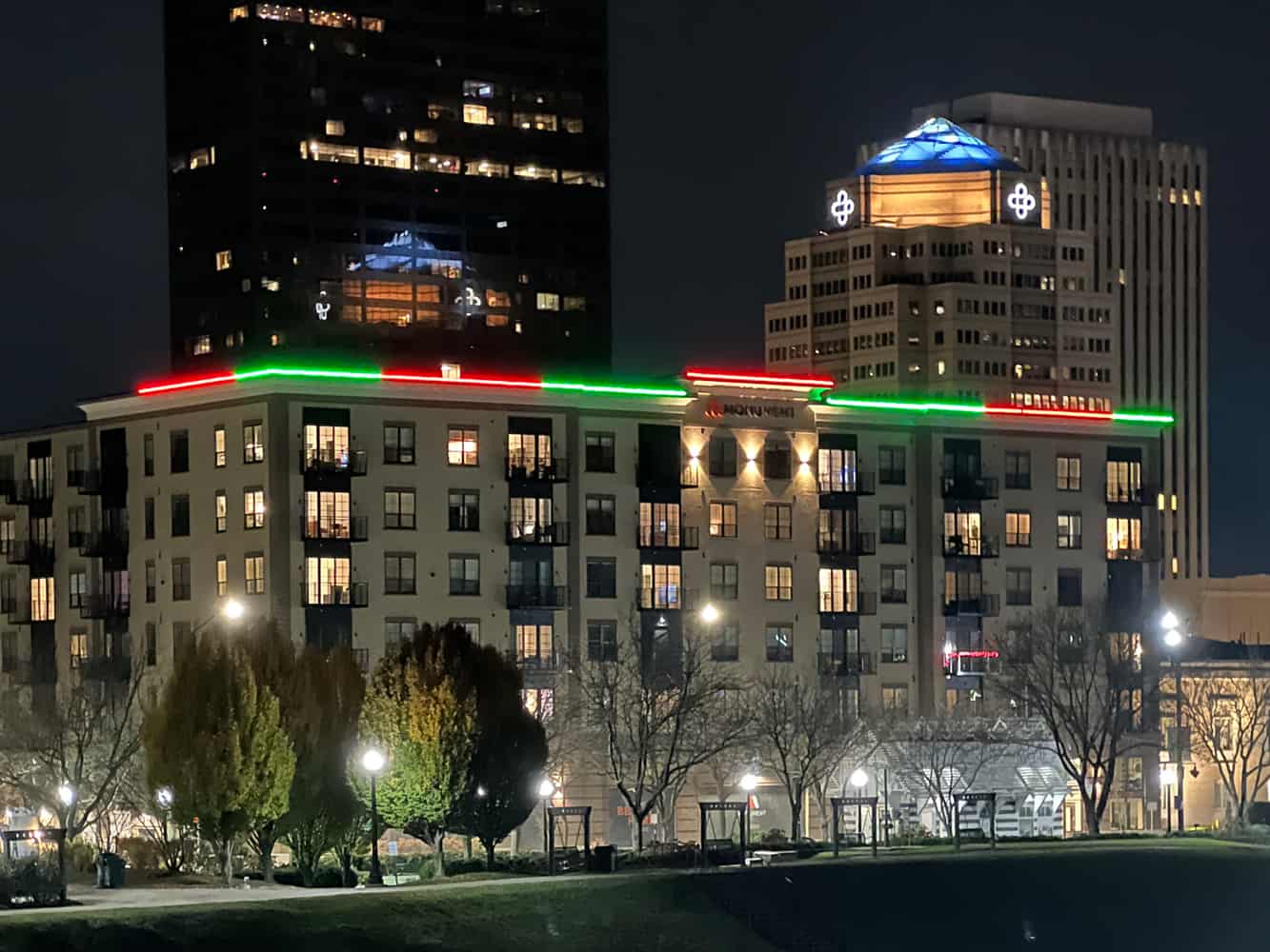 Permanent roofline lighting on a hotel building at night