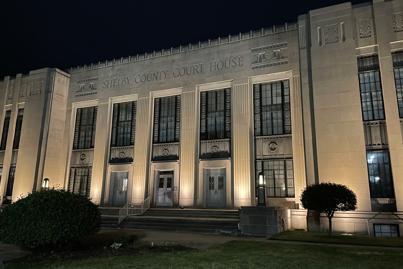 Shelby County Courthouse illuminated with warm architectural lighting at night.