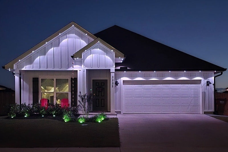 House exterior with decorative Haven Genesis lights at night