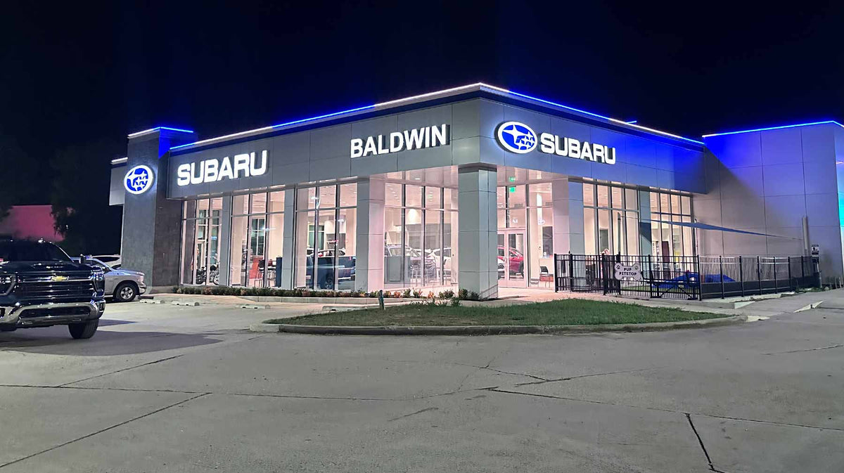 Car dealership with permanent roofline lighting turning the lot into a nightly showcase