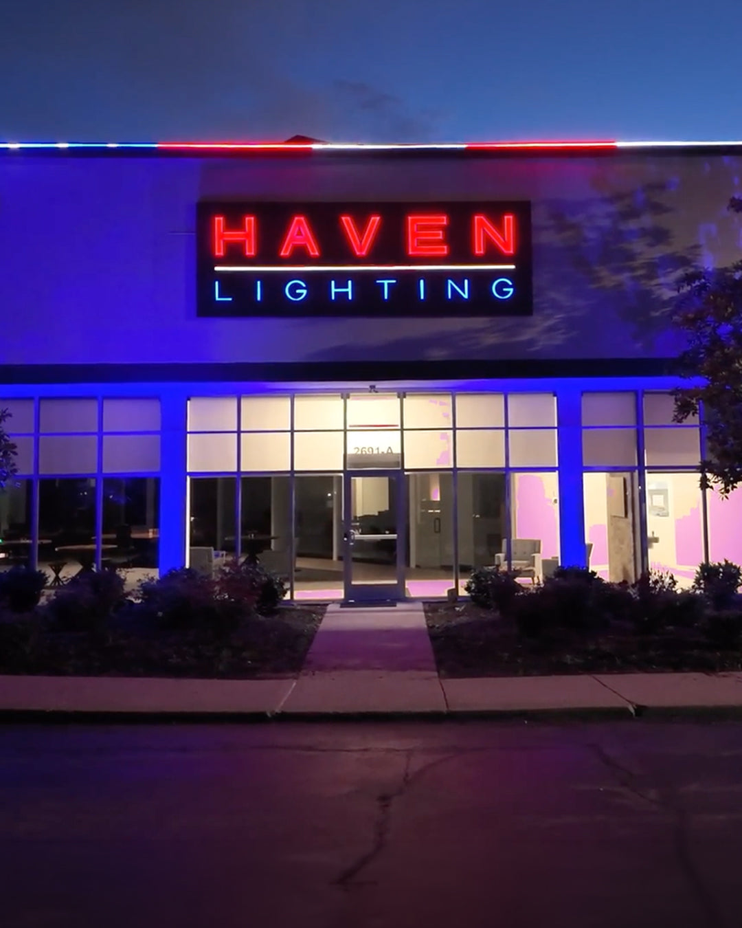 Haven Lighting store front with LED sign at night