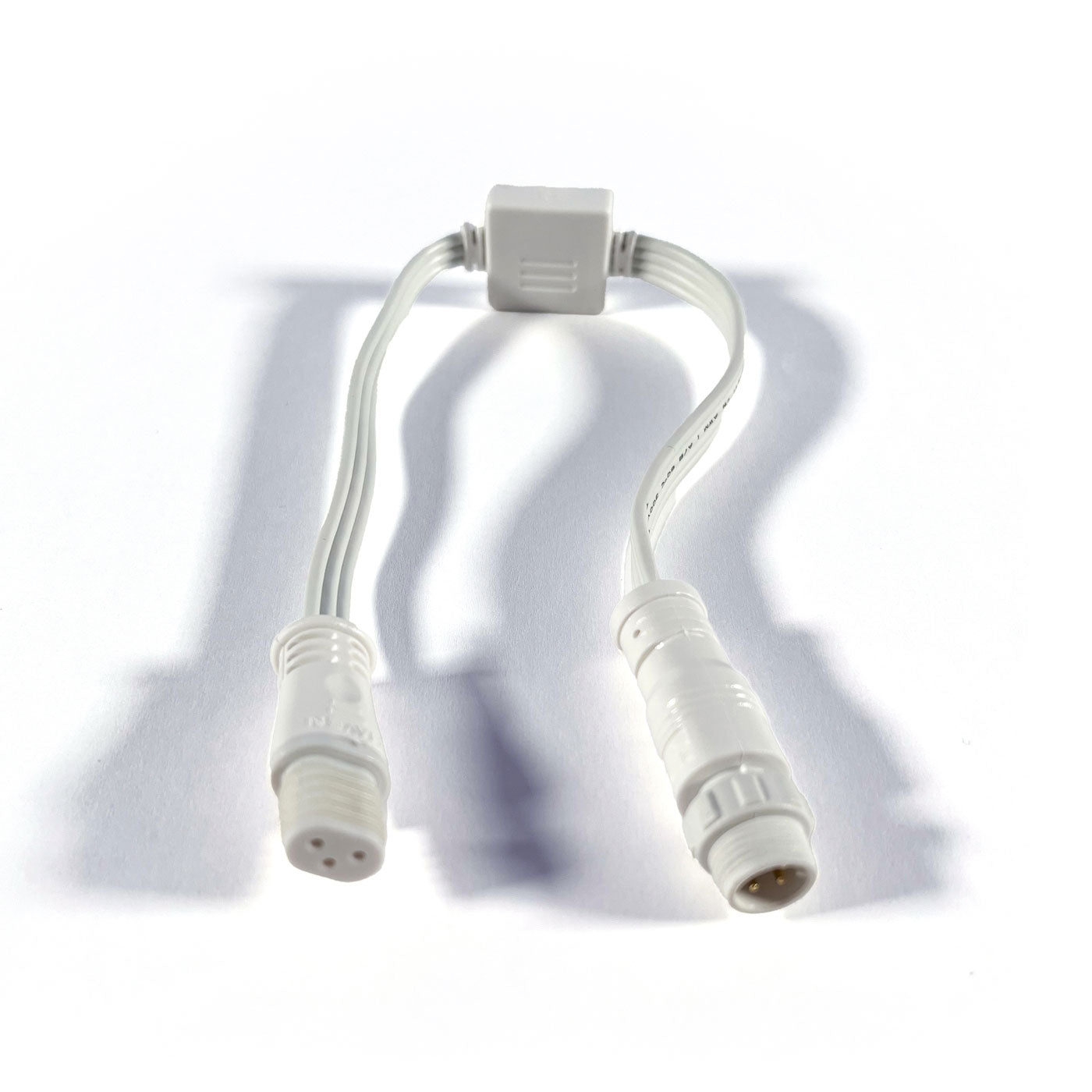Two white cables with connectors on a white background