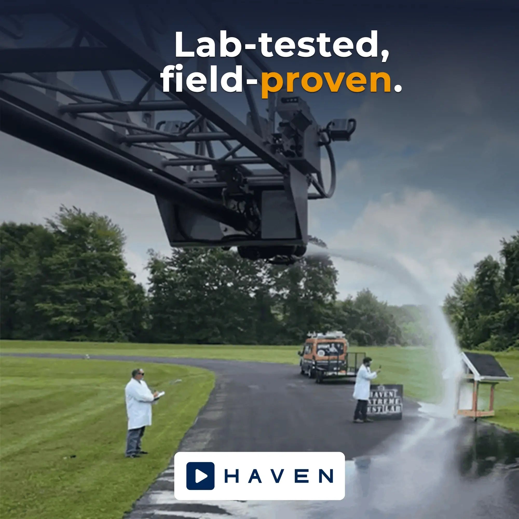 Firetruck spaying water on haven product while lab techs analyze the results